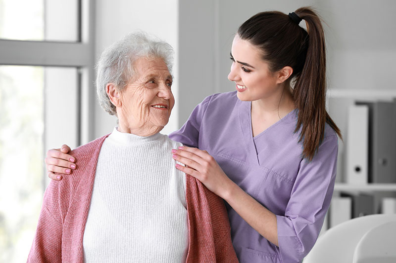 Elderly lady with home carer